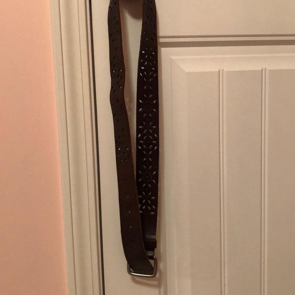 Brown belt with detailing flower designs